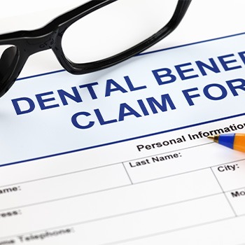 Patient in Dallas looking at dental insurance for dental implants